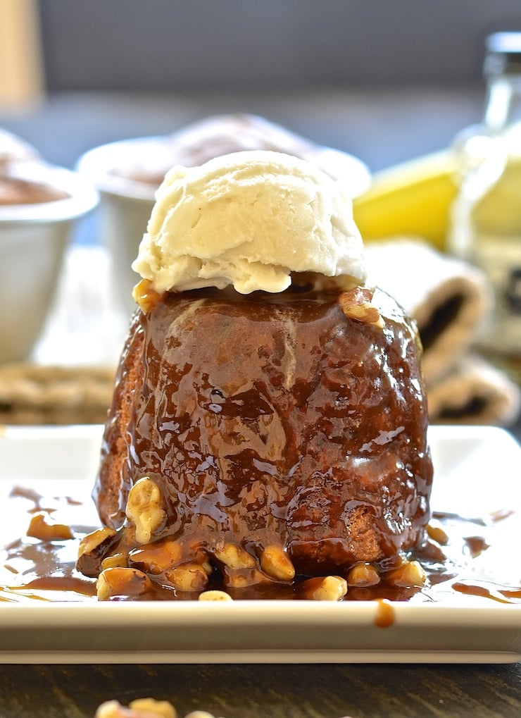 Sticky Banana Date Pudding drizzled in rum caramel and topped with vanilla ice cream 