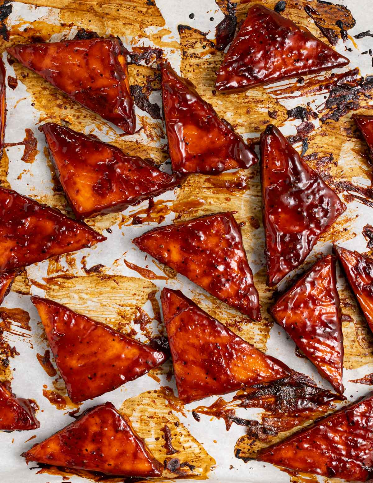 triangles of sticky tofu on a tray