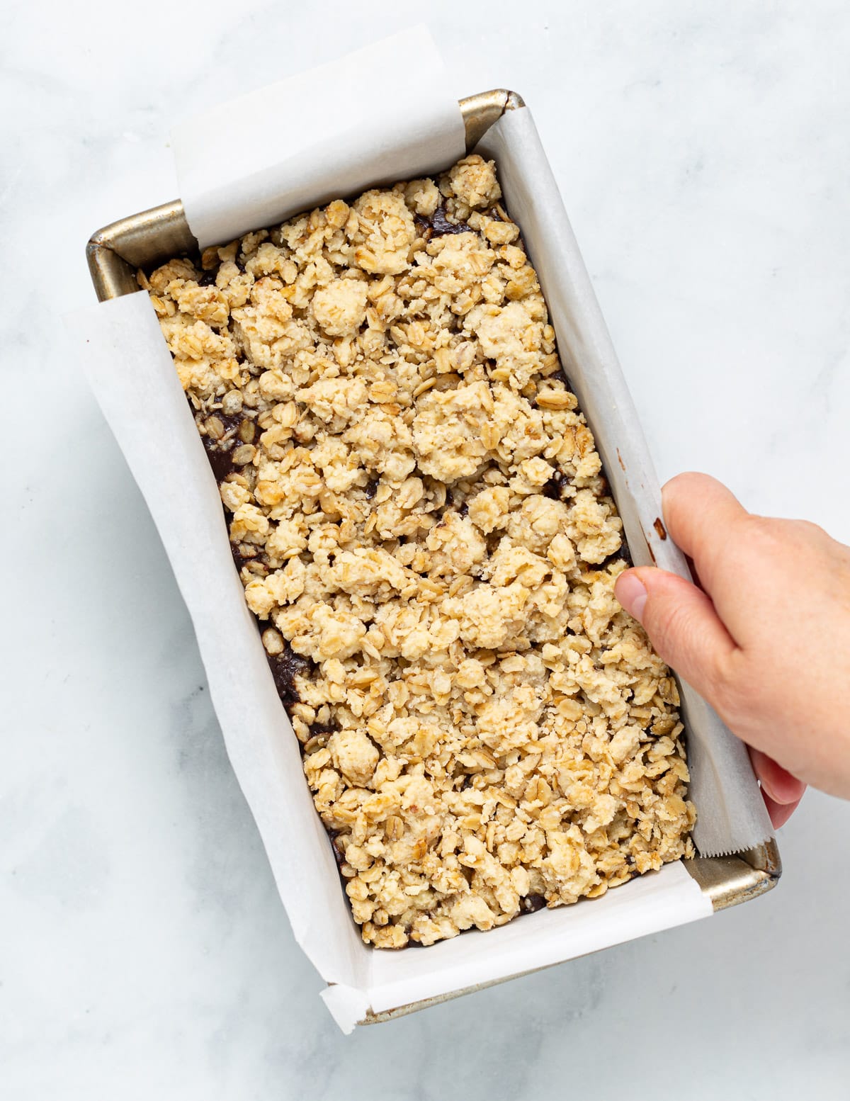 chocolate oat bars in a pan before cutting up