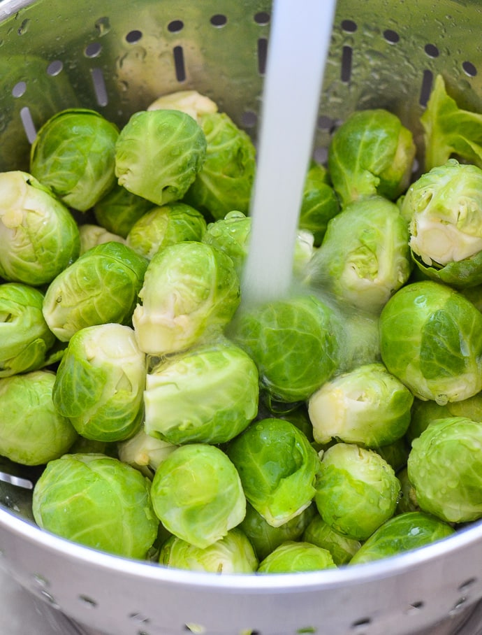 Washing Brussels Sprouts in a colander