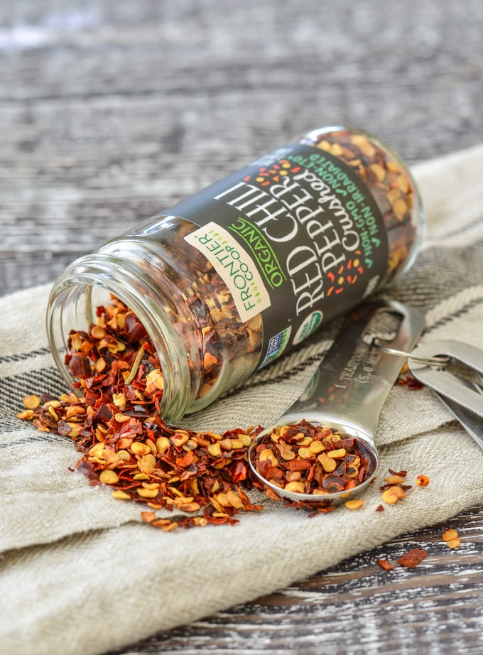 Overturned jar of Frontier Co-op Organic Crushed Red Chili Pepper flakes