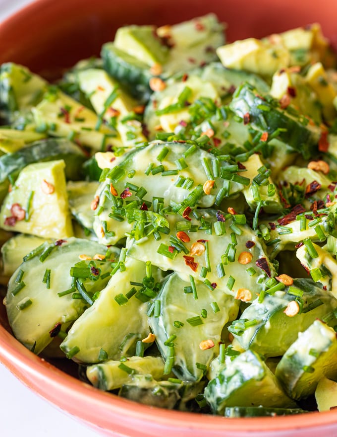 close up of Cucumber Avocado Salad with creamy avocado dressing and chopped fresh chives