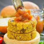 Quick & easy Curried Chickpea Burgers. They are full of curry flavour with bursts of sweetness from plump golden raisins and texture from chopped cashew nuts & chewy oats. Serve them in buns with a generous dollop of mango chutney! 
