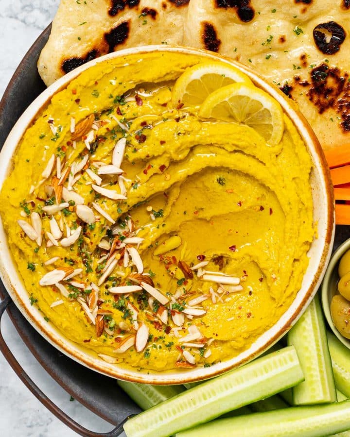a bowl of curry hummus