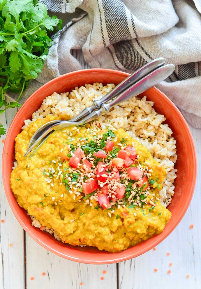 Creamy Red Lentil Dal with rice in a bowl from above