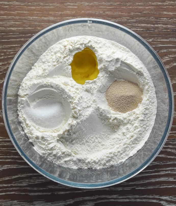 flour, yeast, salt, olive oil in a mixing bowl
