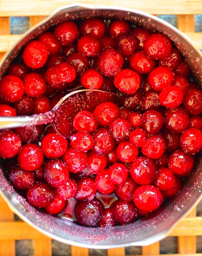 cranberries and sugar cooked gently in a pan