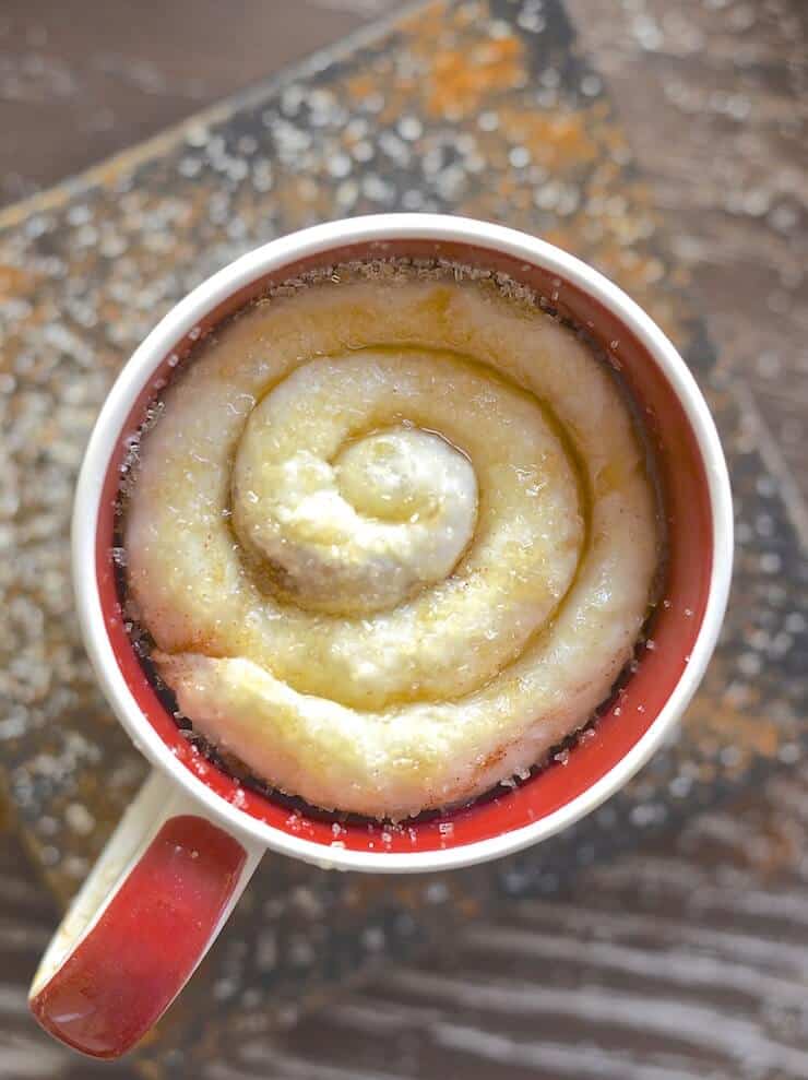 cinnamon roll in a mug taken from above 