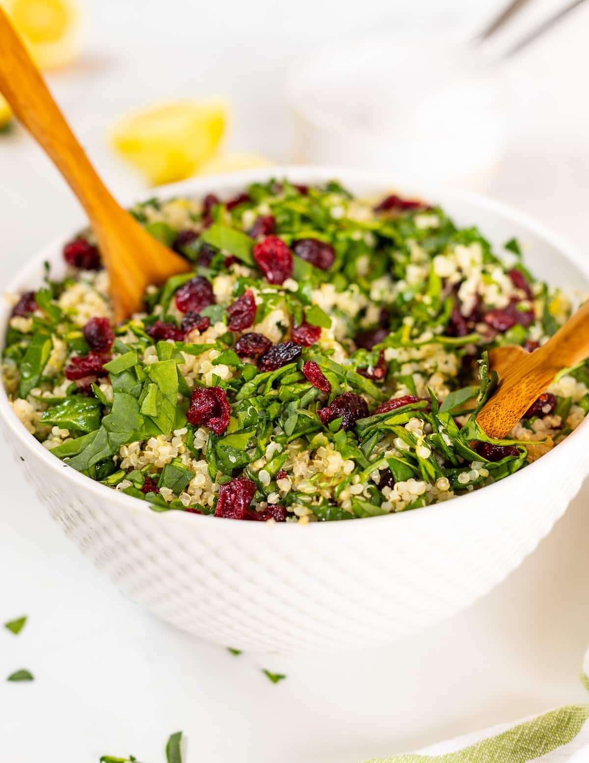 quinoa cranberry salad in large white bowl