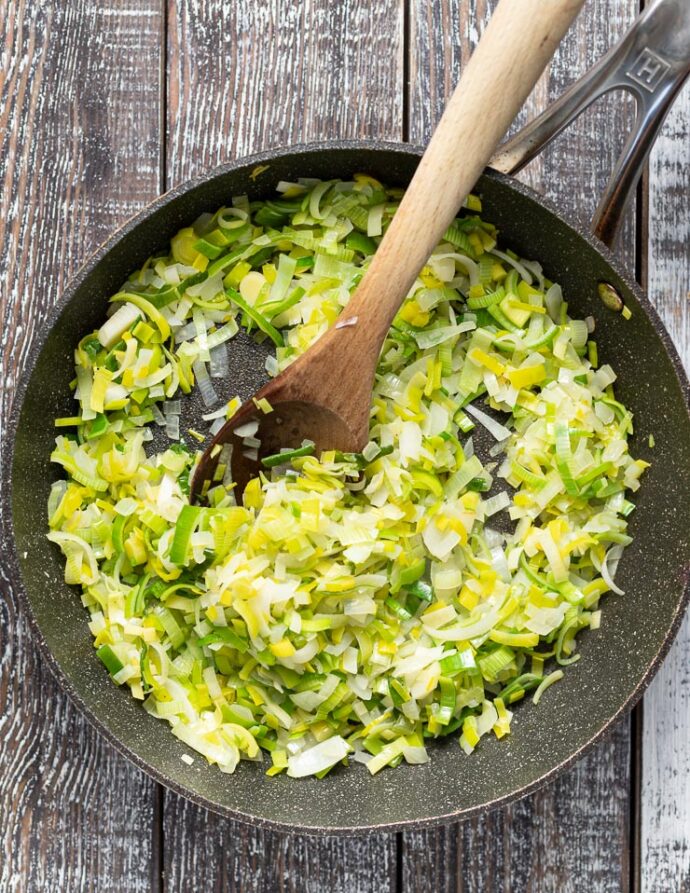 cooked leeks and onions in a pan