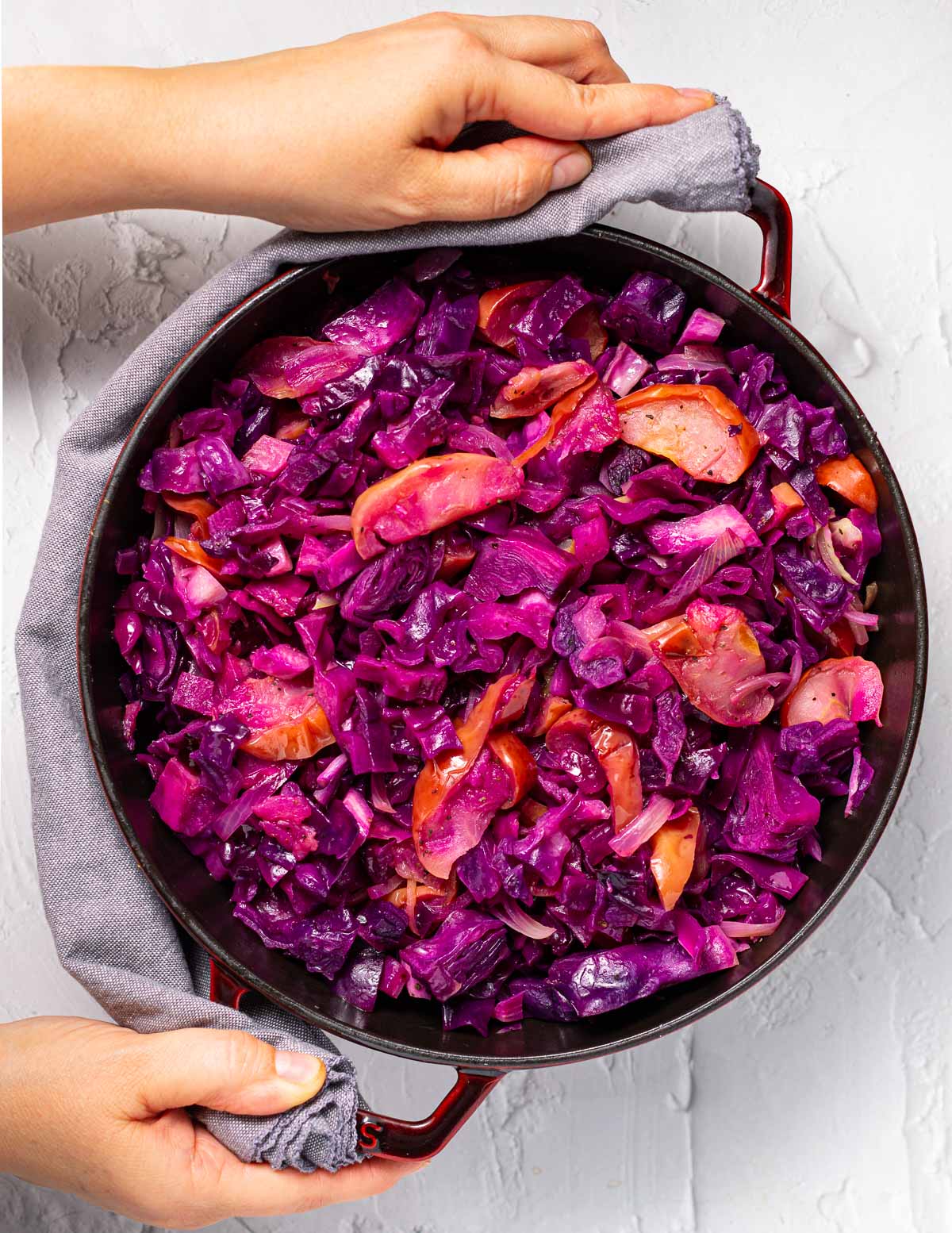 baked red cabbage and apples in a staub skillet