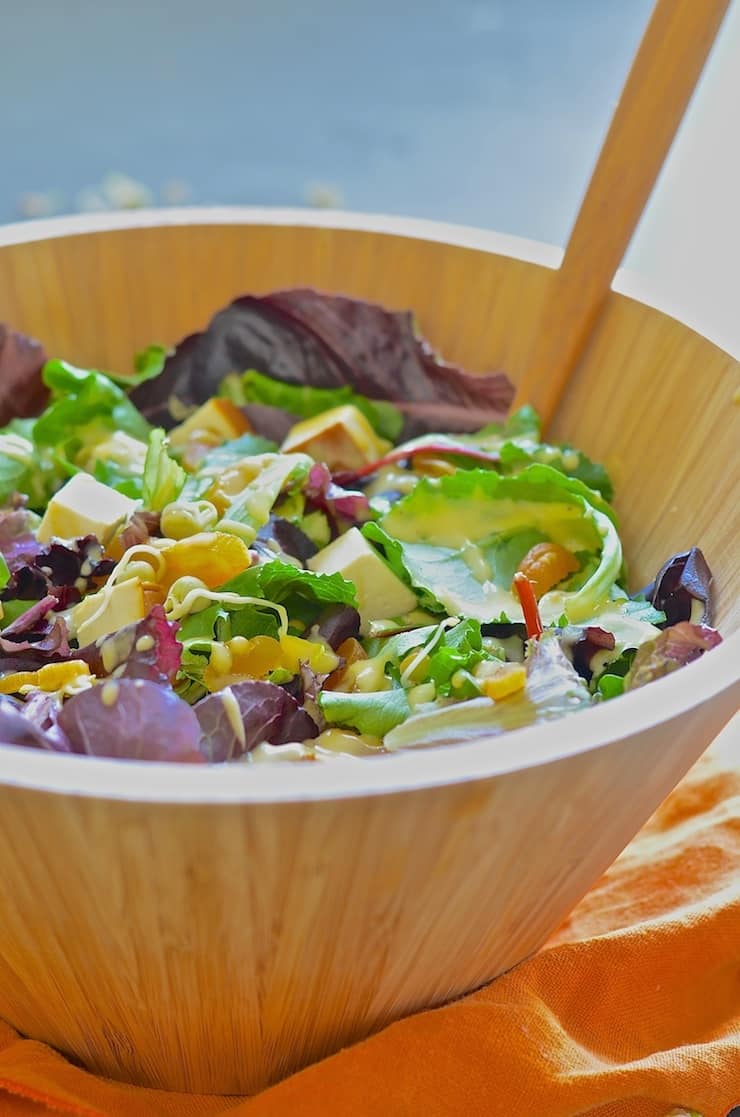 tofu salad with apricot dressing in a large bowl