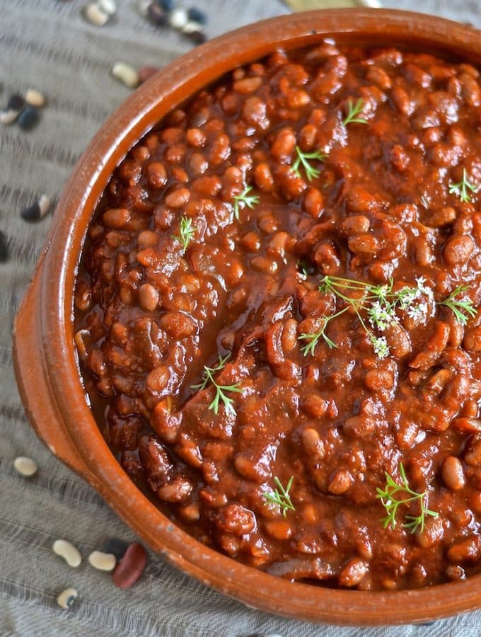 These thick, sweet & smoky slow cooked vegan barbecue baked beans need a little initial prep then you can leave them to do their thing while you do yours. You will be rewarded with a comforting & delicious pot of the most amazing baked beans with rich, deep & complex flavours.