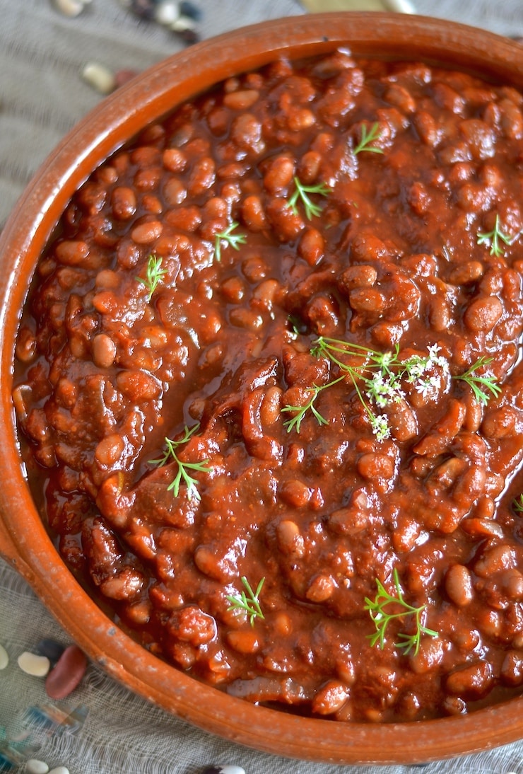 These thick, sweet & smoky slow cooked barbecue baked beans need a little initial prep then you can leave them to do their thing while you do yours. You will be rewarded with a comforting & delicious pot of the most amazing baked beans with rich, deep & complex flavours.