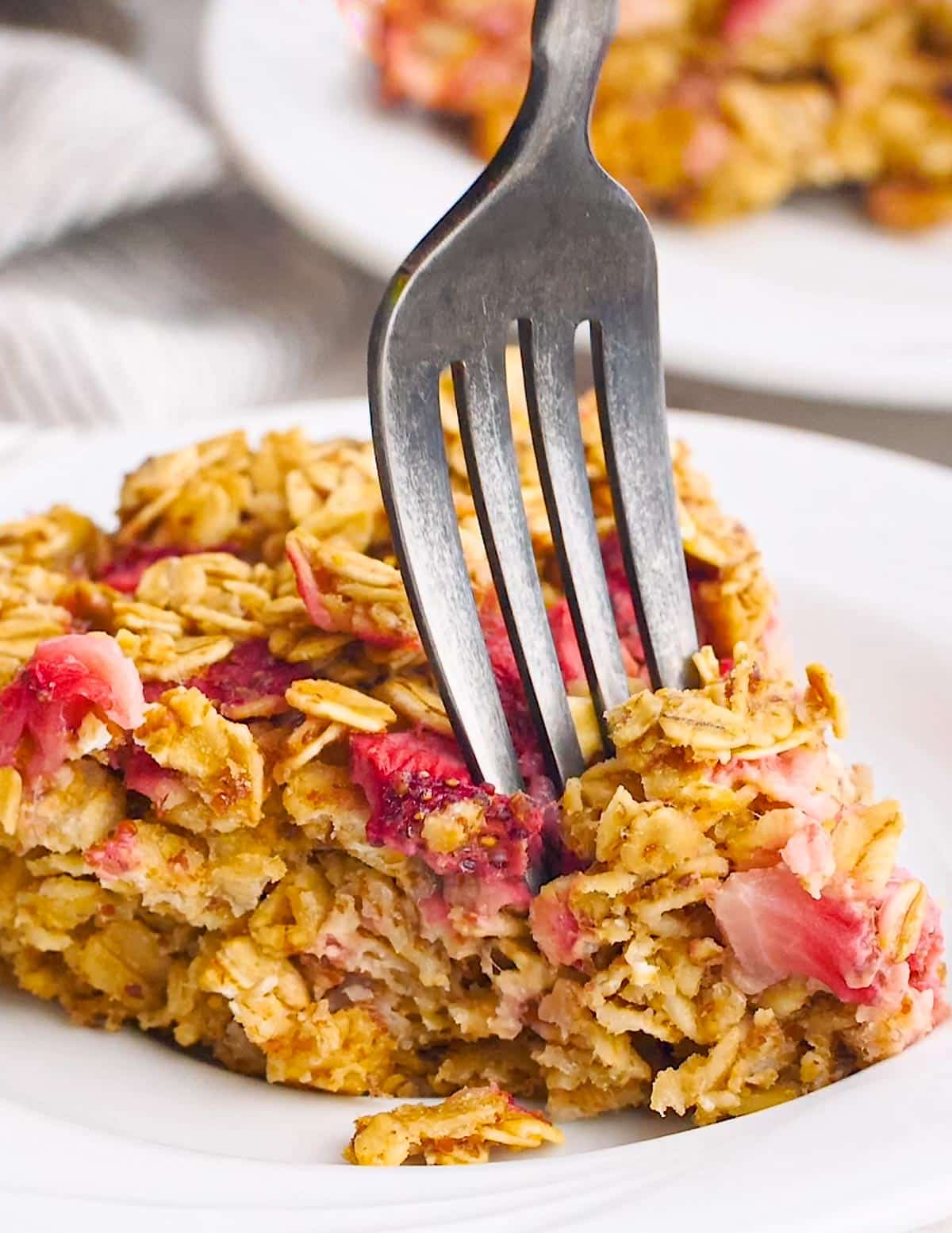 a fork going into a slice of baked oatmeal