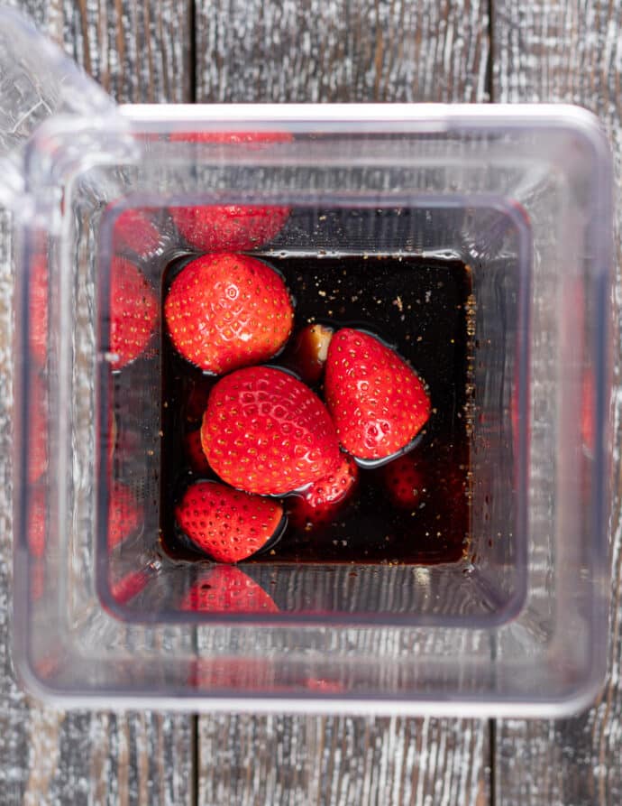 ingredients for oil-free strawberry vinaigrette in a blender