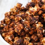 close up hot of caramel chocolate vegan popcorn in a bowl