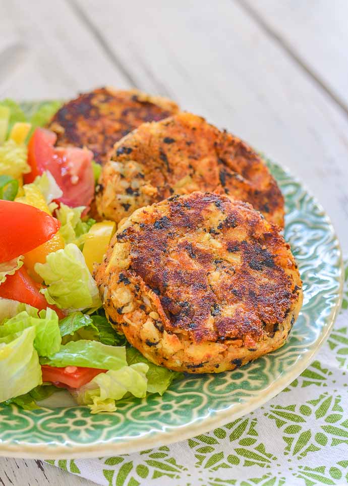 3 Thai Style Vegan Crab Cakes on a pretty plate with salad