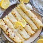 Foolproof Vegan English Pancakes. Quick & easy to make & great for dessert or brunch! They are beautifully freckled and so good straight from the pan, served glistening with fresh lemon juice & sugar.