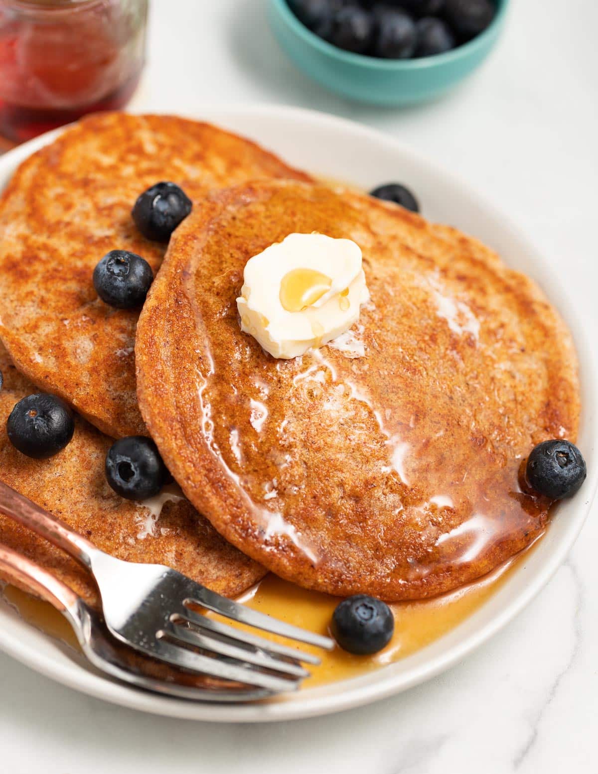 gingerbread pancakes on a plate with blueberries