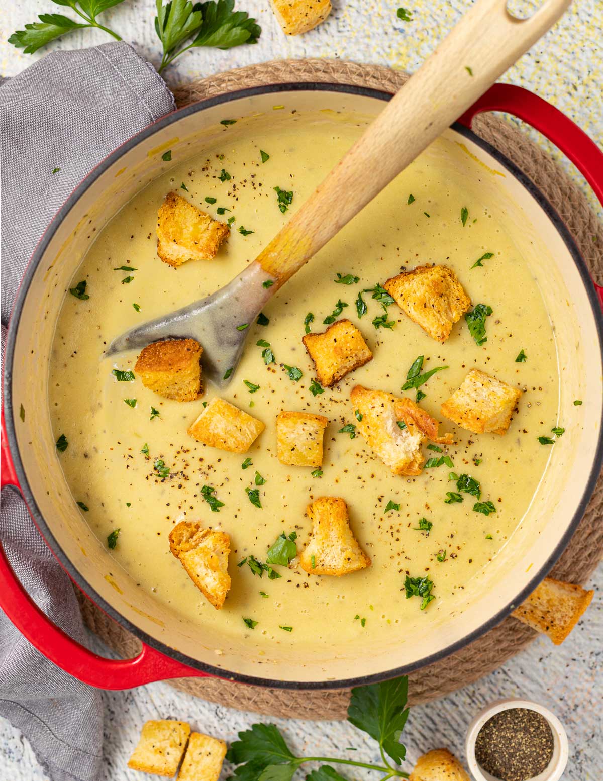 a pan of soup with croutons 