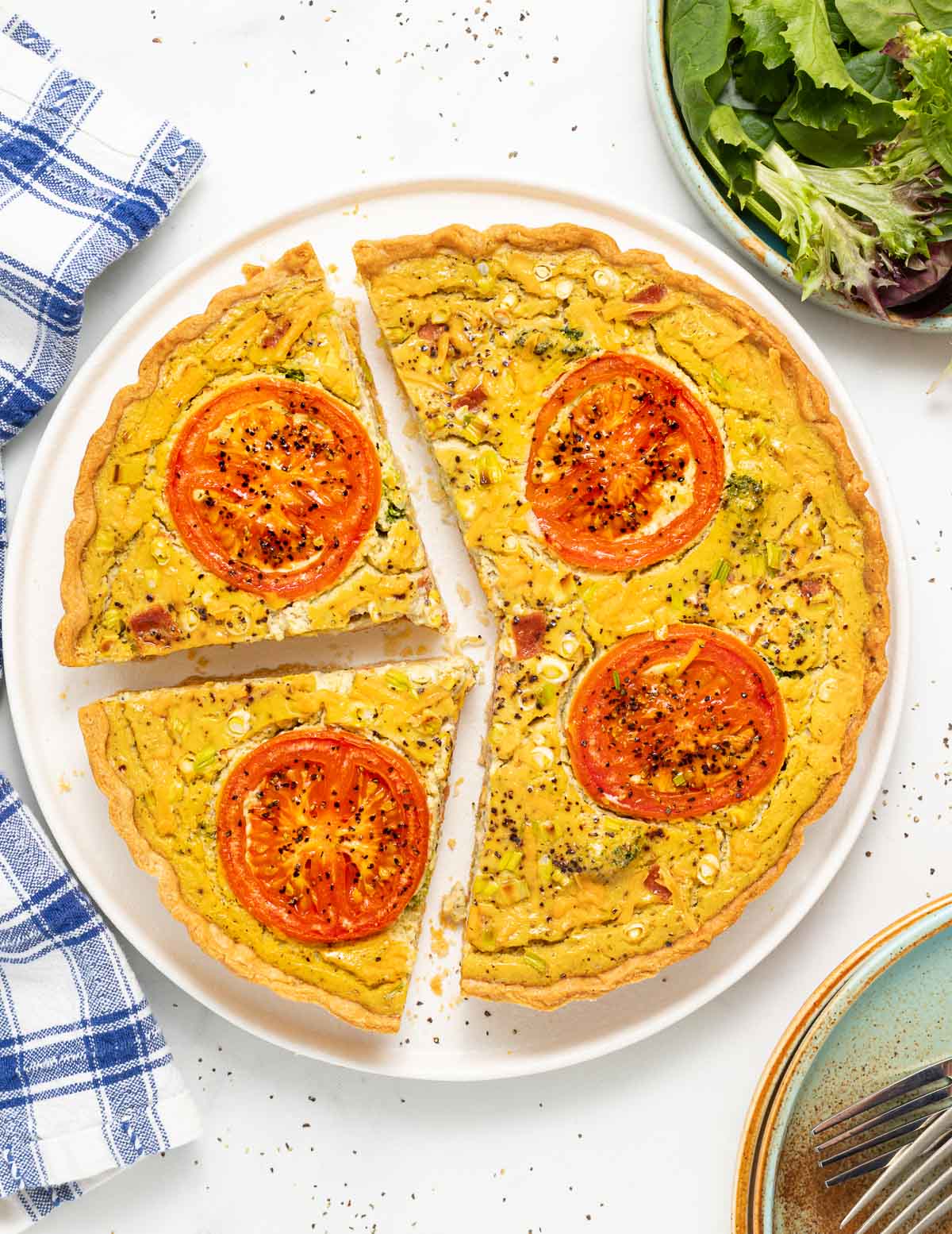 a sliced quiche on a plate