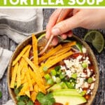 Vegan Tortilla Soup with rich, bold, tomatoey, smoky, limey, garlicky flavor and piles of crispy, crunchy baked tortilla strips. Then come the extra toppings which really seal the deal. It's quick and easy to make and totally delicious!
