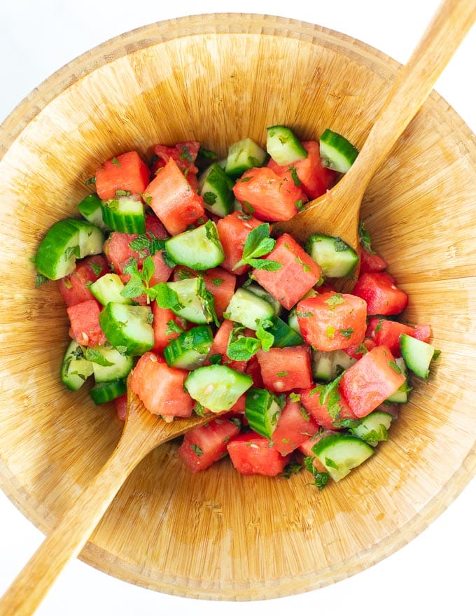 Watermelon Mint Salad in a wooden salad bowl, shot from above 