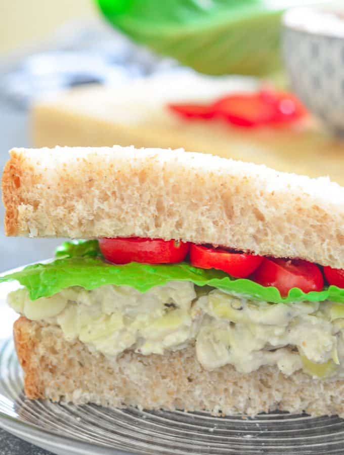 Tuck a napkin into your collar because you're gonna need it when you bite into a big, thick doorstep of a sandwich stuffed to bursting with this creamy Smashed White Bean & Artichoke Vegan Sandwich Filling!
